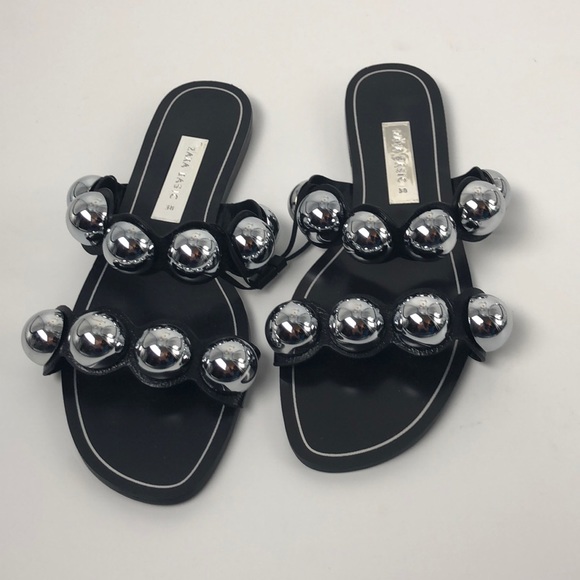 black slides with silver balls